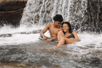 couple under a waterfall